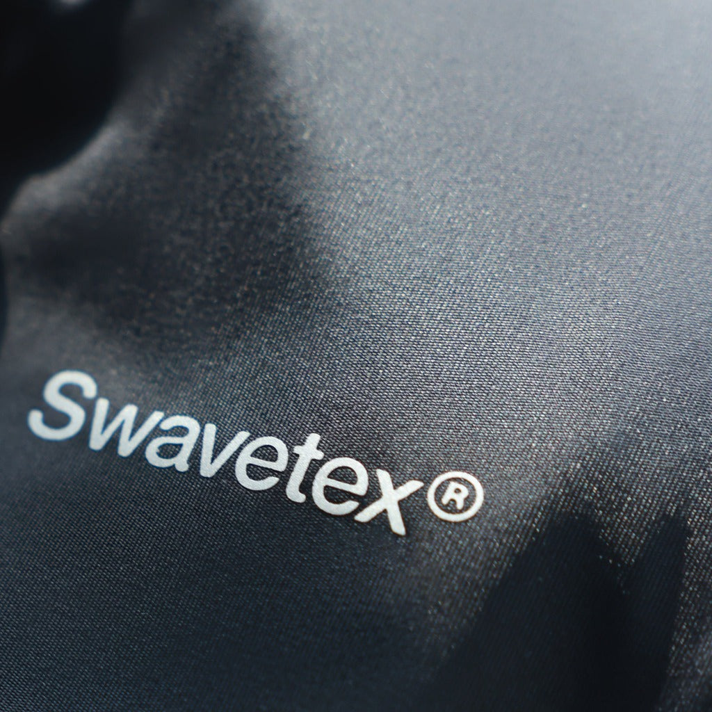 Real close-up of Swavetex S11 premium black satin fabric with smooth finish